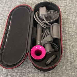 Dyson Hair dryer with pink accent